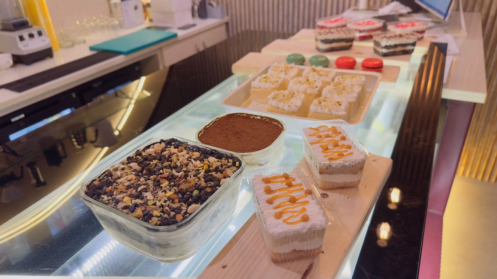 HiCafe dessert counter with tiramisu, macarons and layered cakes